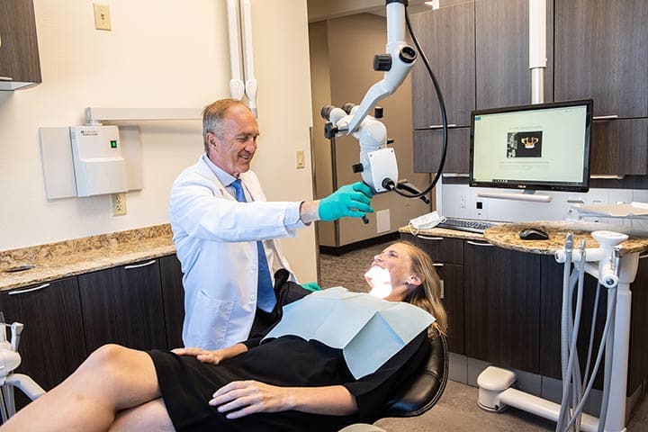 Meet our Staff Dr. Rossow DDS, Laura Noce DMD, Joseph Burns DDS, Cheri Neal DDS. Aspen Dental General, Cosmetic, Restorative, Preventative, Family Dentistry dentist in Denver CO 80206 Dr. Timothy Hart with dental patient Aspen Dental Denver CO